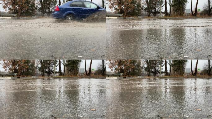 雨天潮湿路面上的城市交通车辆驶过水坑