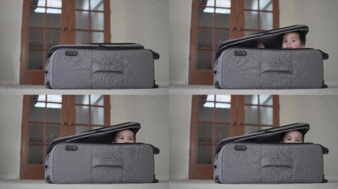 藏在行李箱里的小男孩