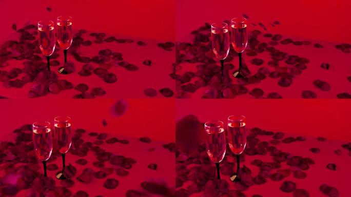 红色装饰的节日餐桌上摆着两杯香槟酒