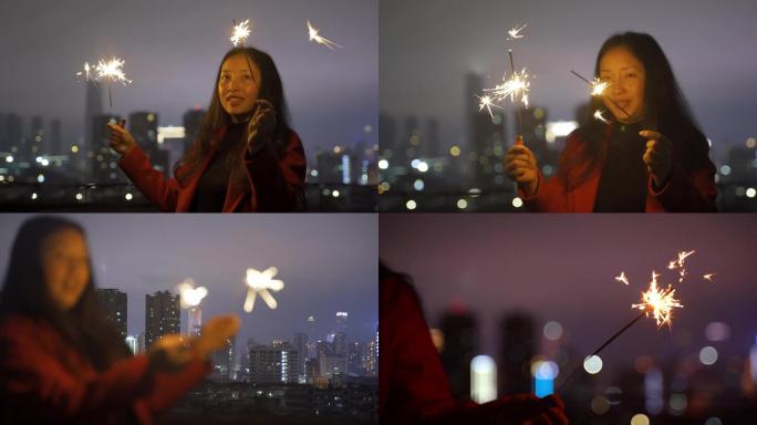 女孩点燃仙女棒，放烟花，过年氛围烟火唯美