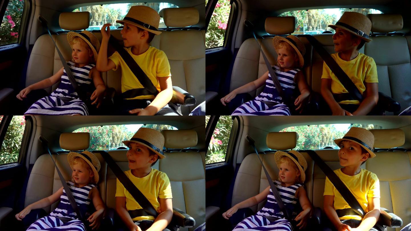 坐在车里的男孩和女孩