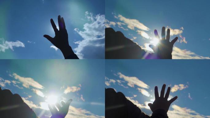蓝天白云手指触摸阳光时光流逝希望手指剪影