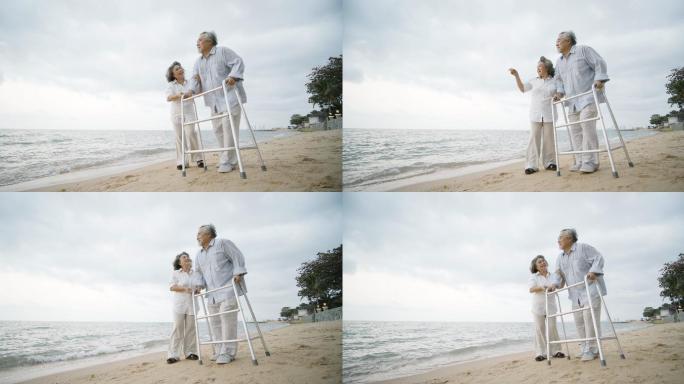 妻子帮助丈夫沿着海滩行走。