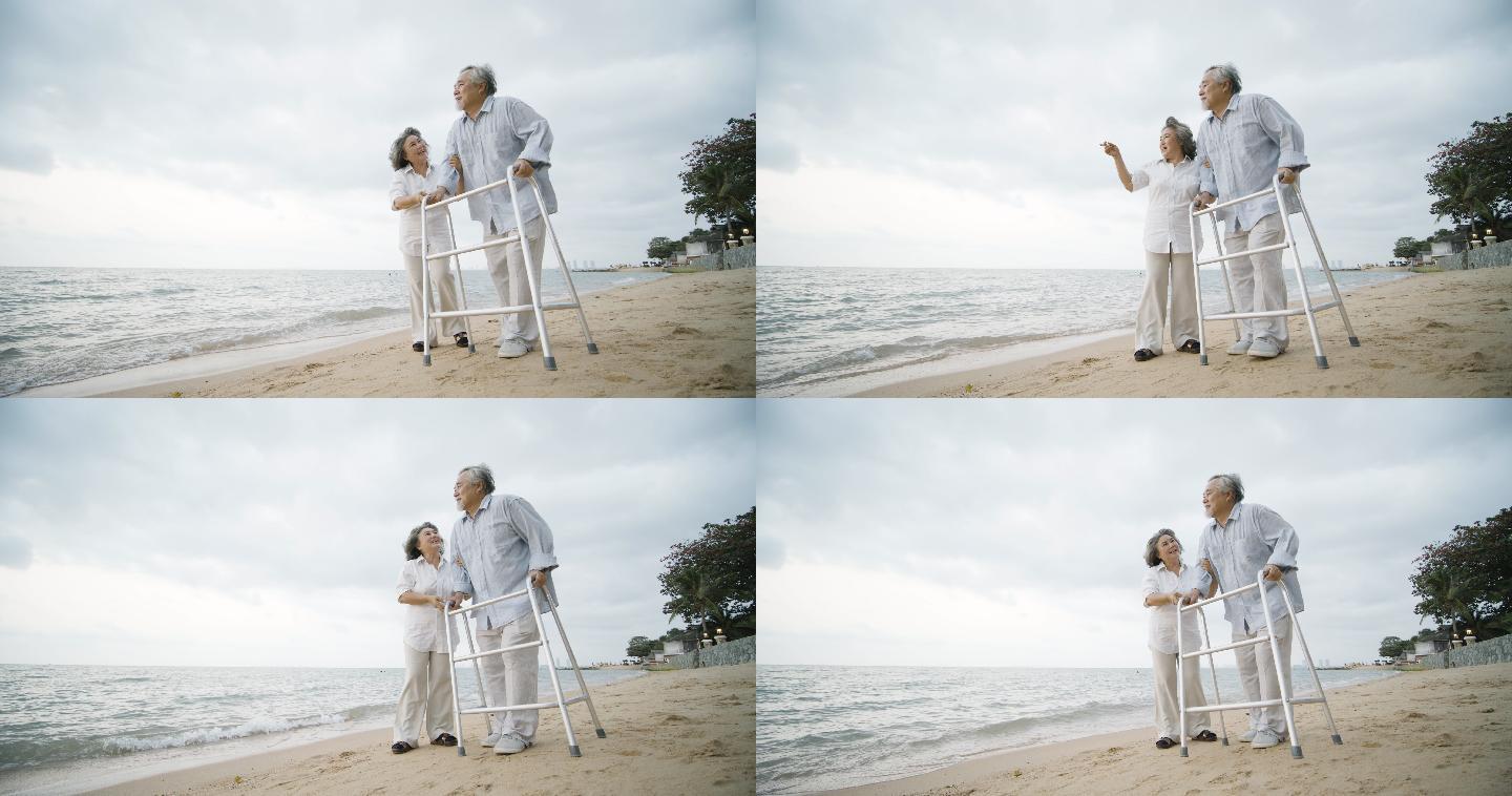 妻子帮助丈夫沿着海滩行走。
