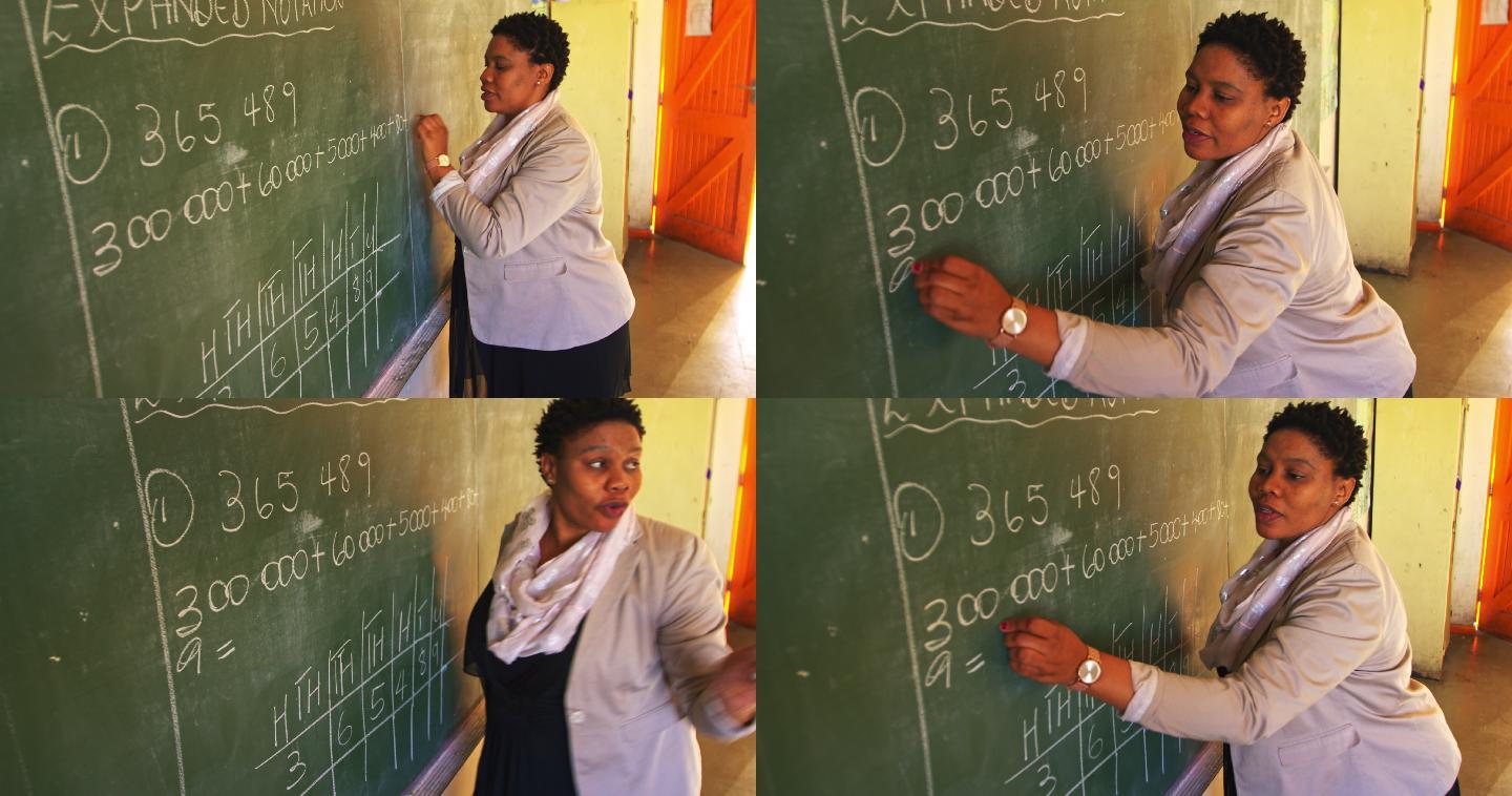 女老师在黑板写下公式