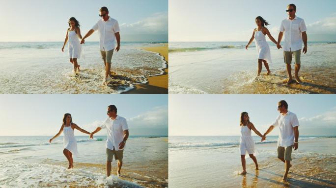 日落时在海滩上散步的情侣