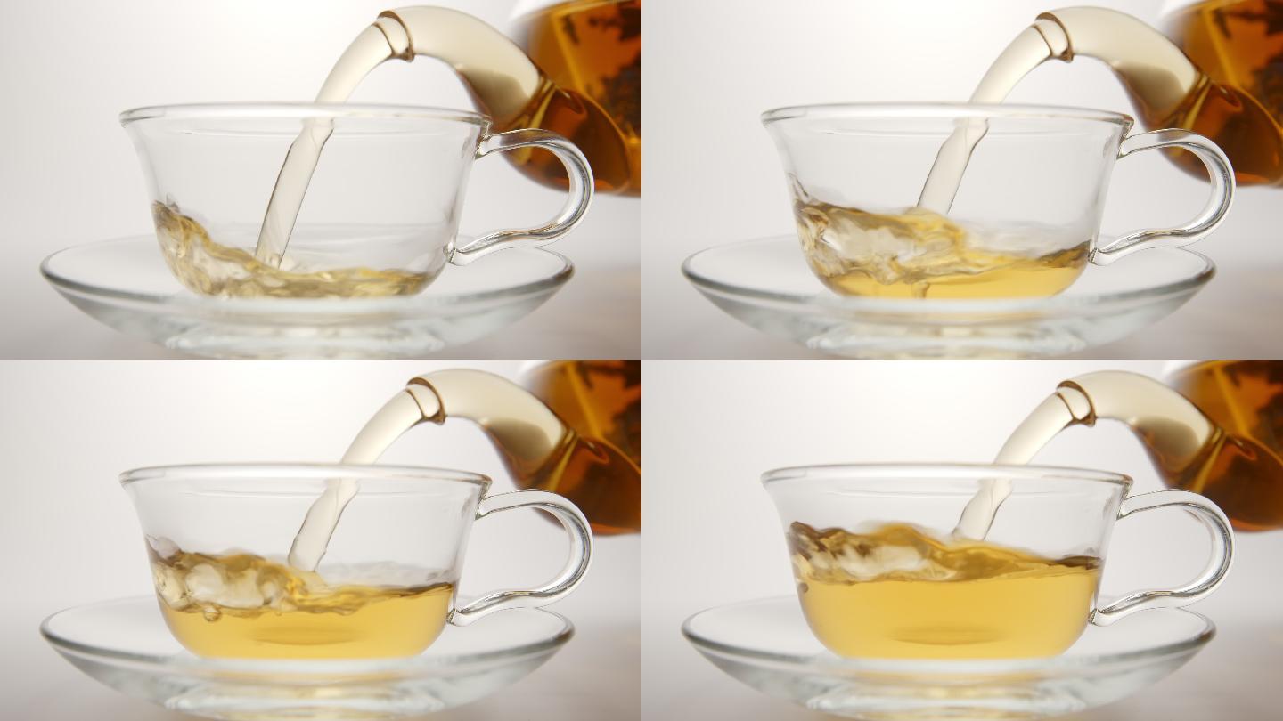 慢动作：新鲜茶从茶壶流入茶杯