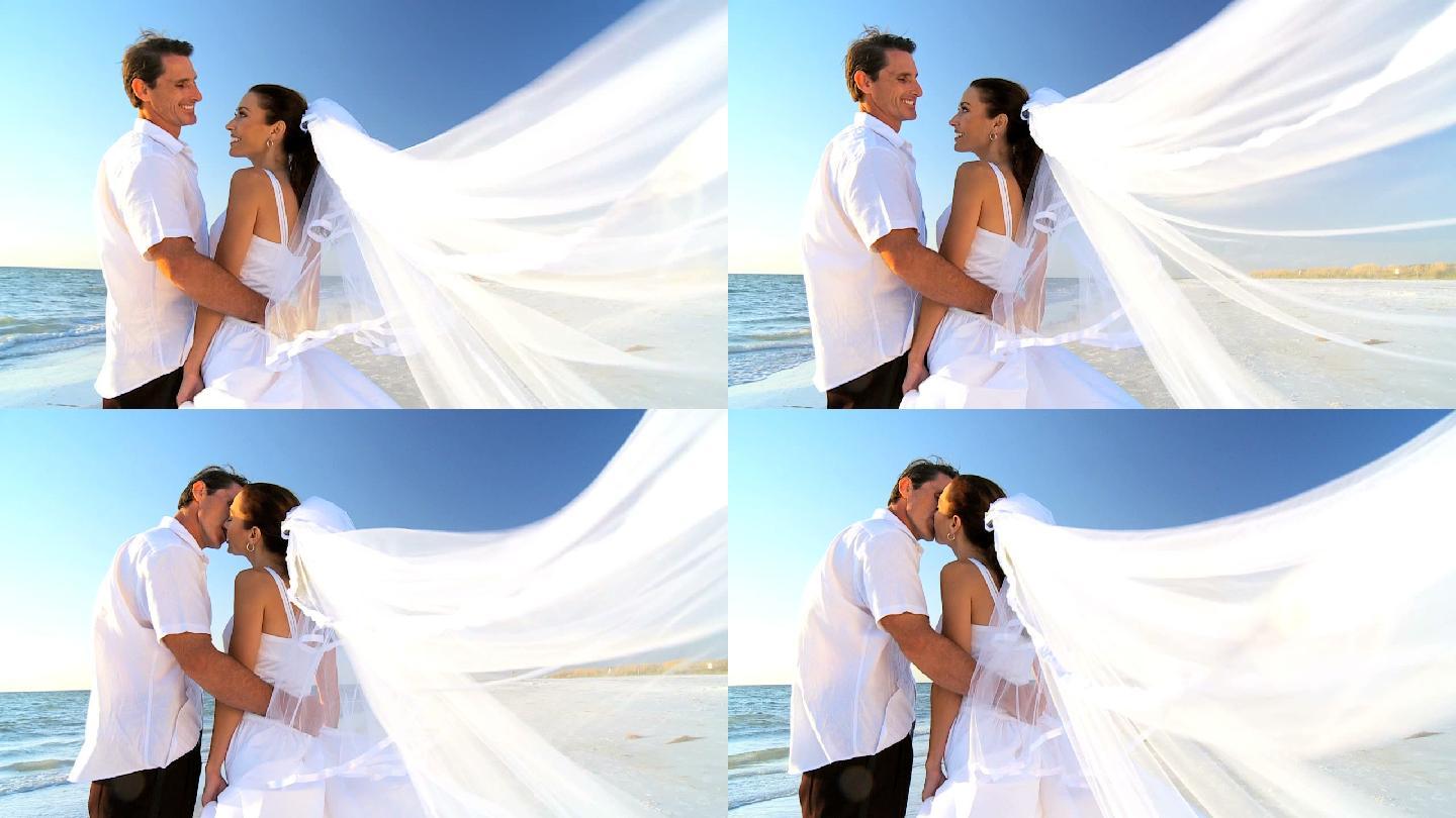 海滩上的新郎新娘婚纱照新婚新人婚庆现场