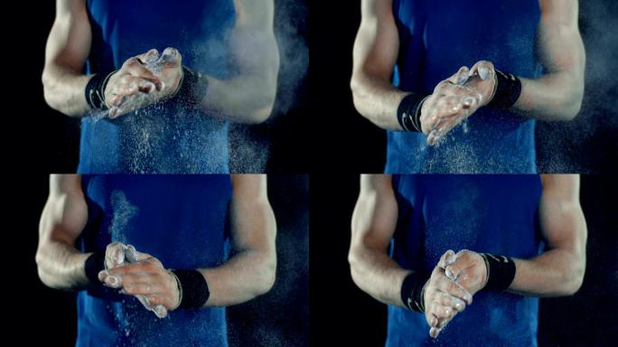 体操运动员正在使用镁粉增加手掌摩擦力