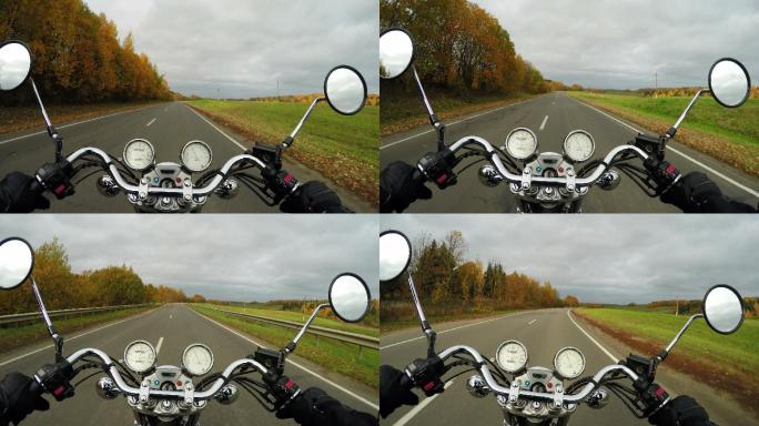 摩托车行驶在美丽的秋日大道上