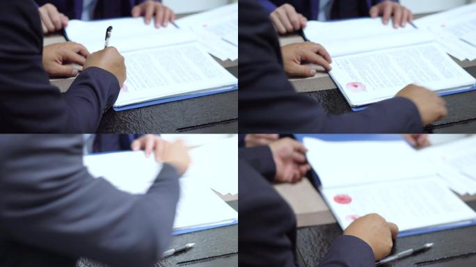 客户在合同文件上签字盖章素材