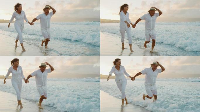 浪漫的中年夫妇在度假时漫步在海滩上
