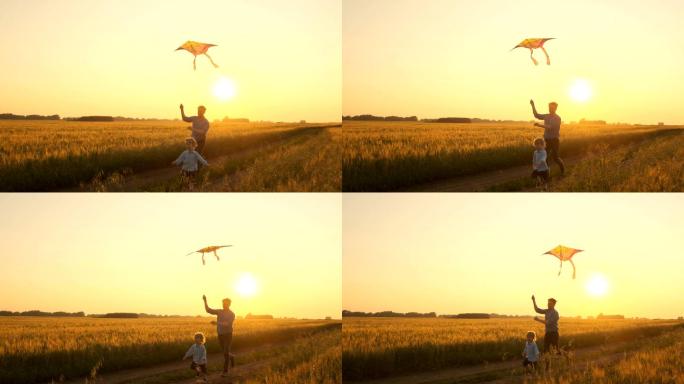 日落时分父子俩在大自然中玩风筝