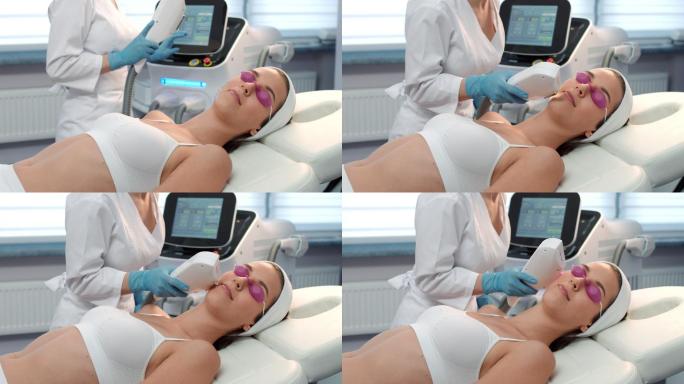 美容师执行激光治疗程序。