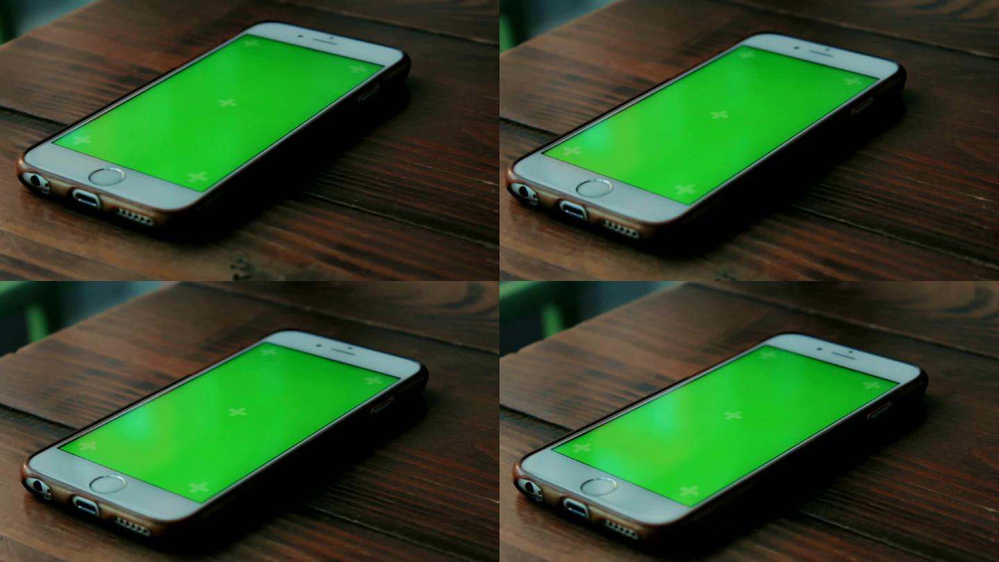 桌上的绿幕手机