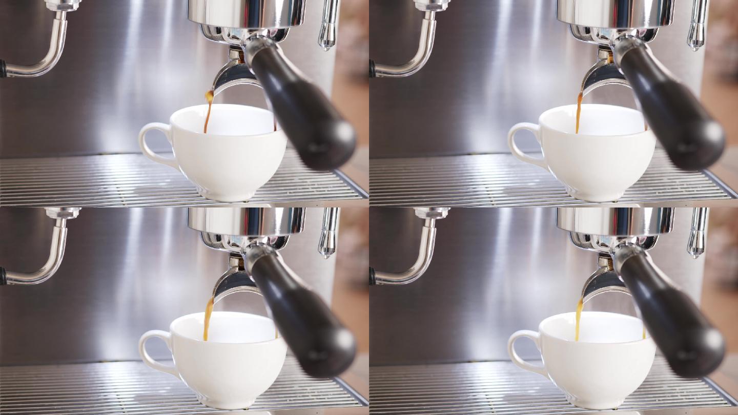 咖啡机将浓咖啡热咖啡倒入咖啡白杯中。