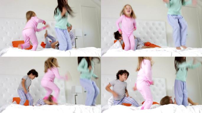 孩子们在父母的床上蹦蹦跳跳玩耍