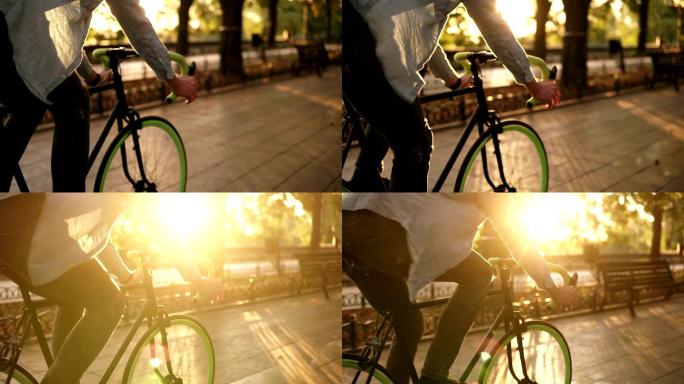男子在晨间公园或林荫大道骑自行车