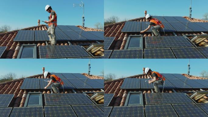 电工安装家用屋顶上的太阳能光伏板