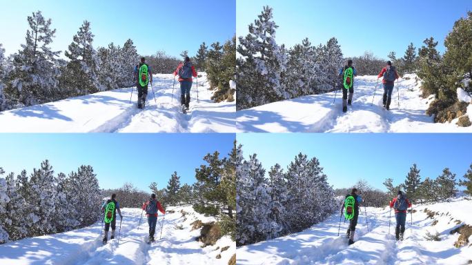 两个徒步旅行者在冬天爬山。
