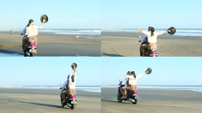 浪漫的年轻夫妇在海边骑摩托车