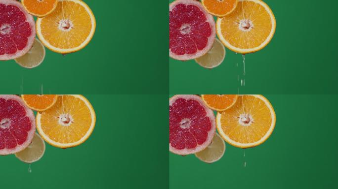 成熟的柑橘片滴水。