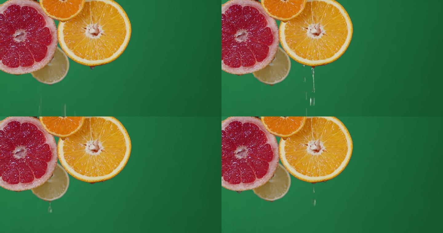 成熟的柑橘片滴水。