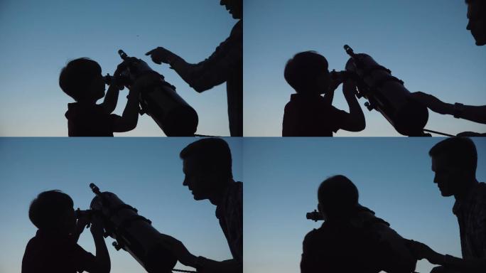 男子和一个小男孩通过望远镜近距离观察。
