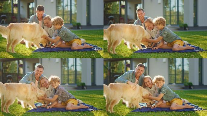 父亲、母亲和儿子在草坪上和宠物狗玩耍
