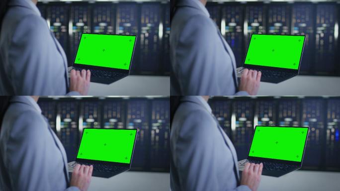 IT专家使用模拟绿色屏幕笔记本电脑