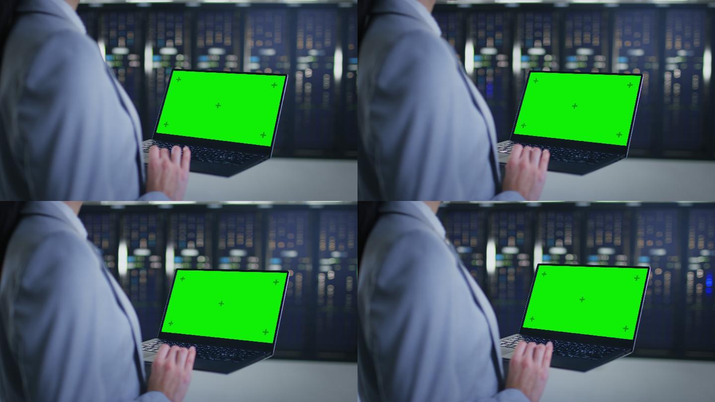 IT专家使用模拟绿色屏幕笔记本电脑