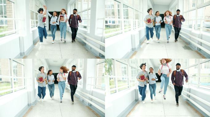 男女学生在大学走廊奔跑