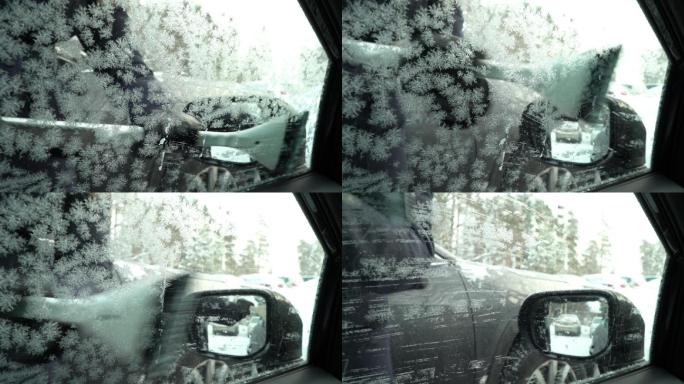 年轻女子用雪刷从车窗刮冰