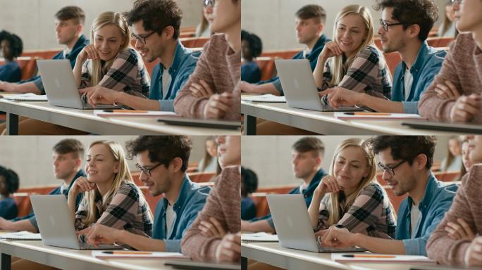 在教室里，男女学生共享并使用笔记本电脑