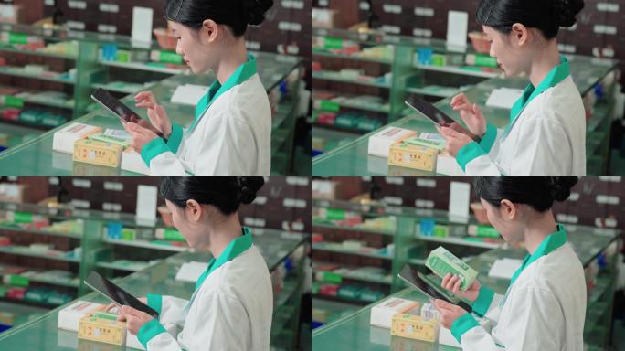 一名年轻女子在药店使用数字平板电脑