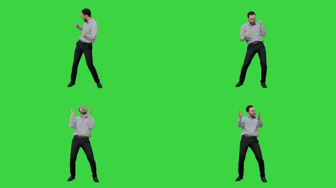 快乐男人在绿色屏幕上表演舞蹈