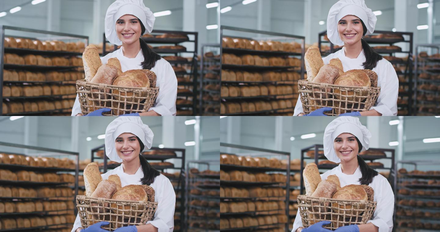 在一家大型面包店的女子拿着烤面包