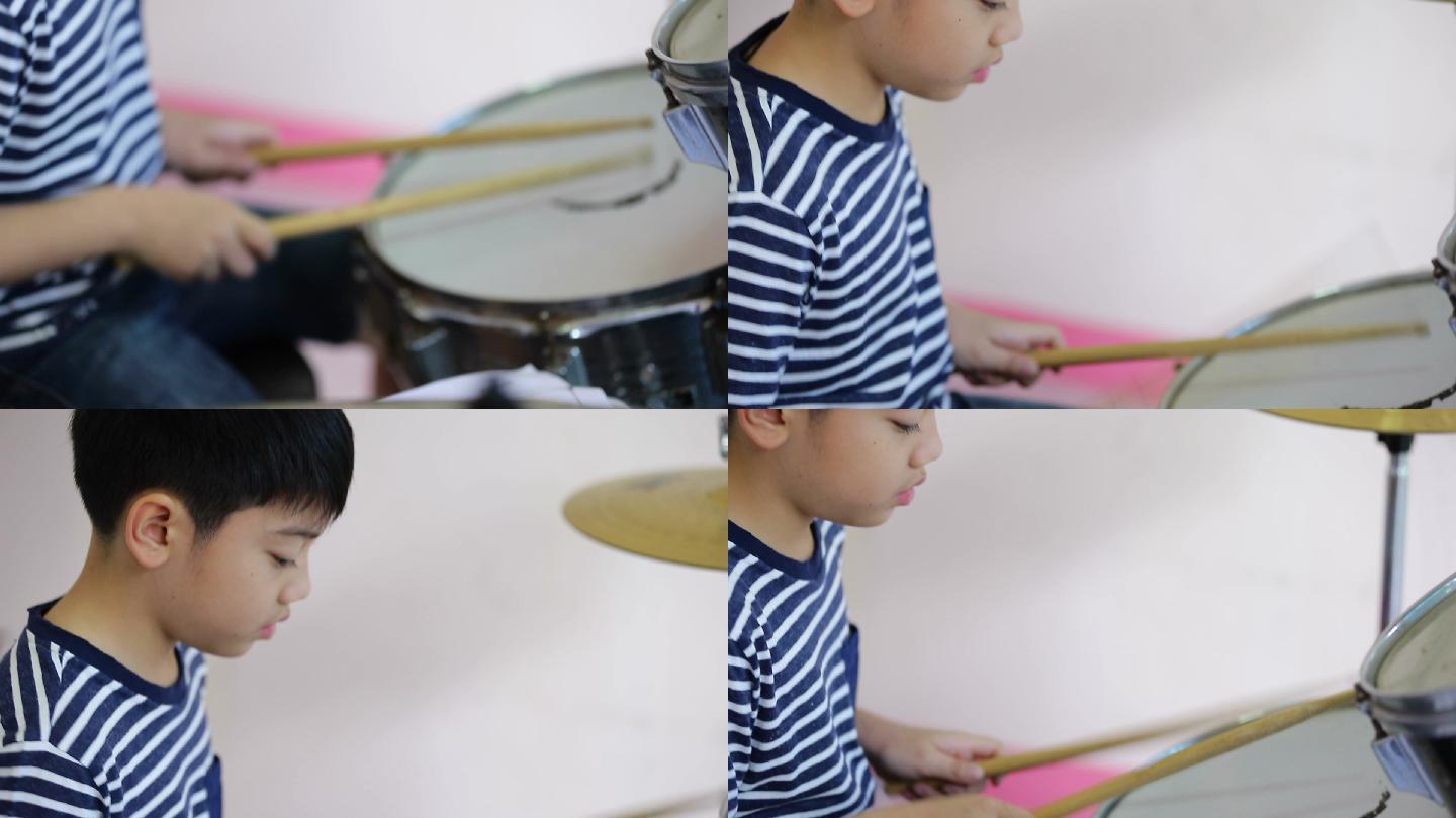 男孩鼓手为表演而练习