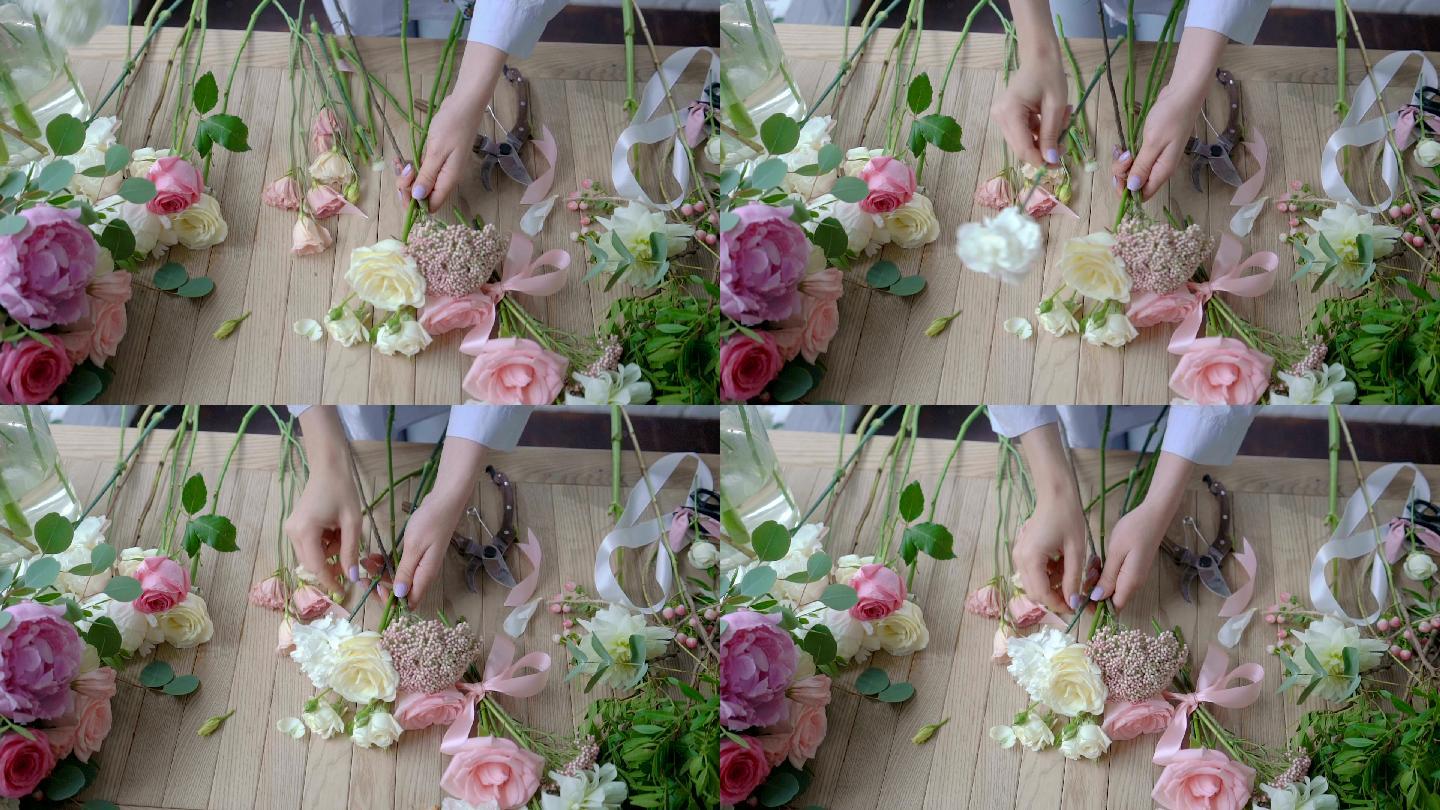女花商在木桌上制作花束