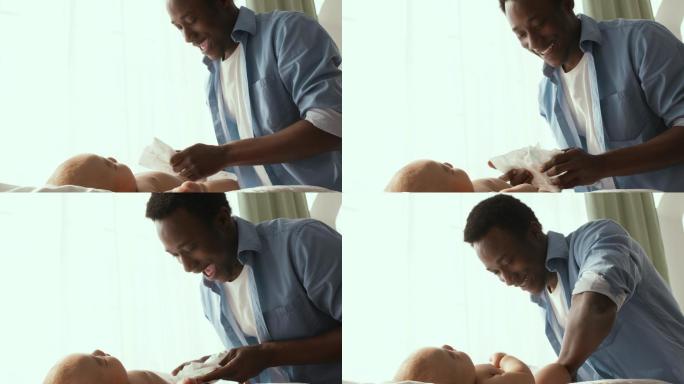父亲正在为他的新生婴儿换尿布