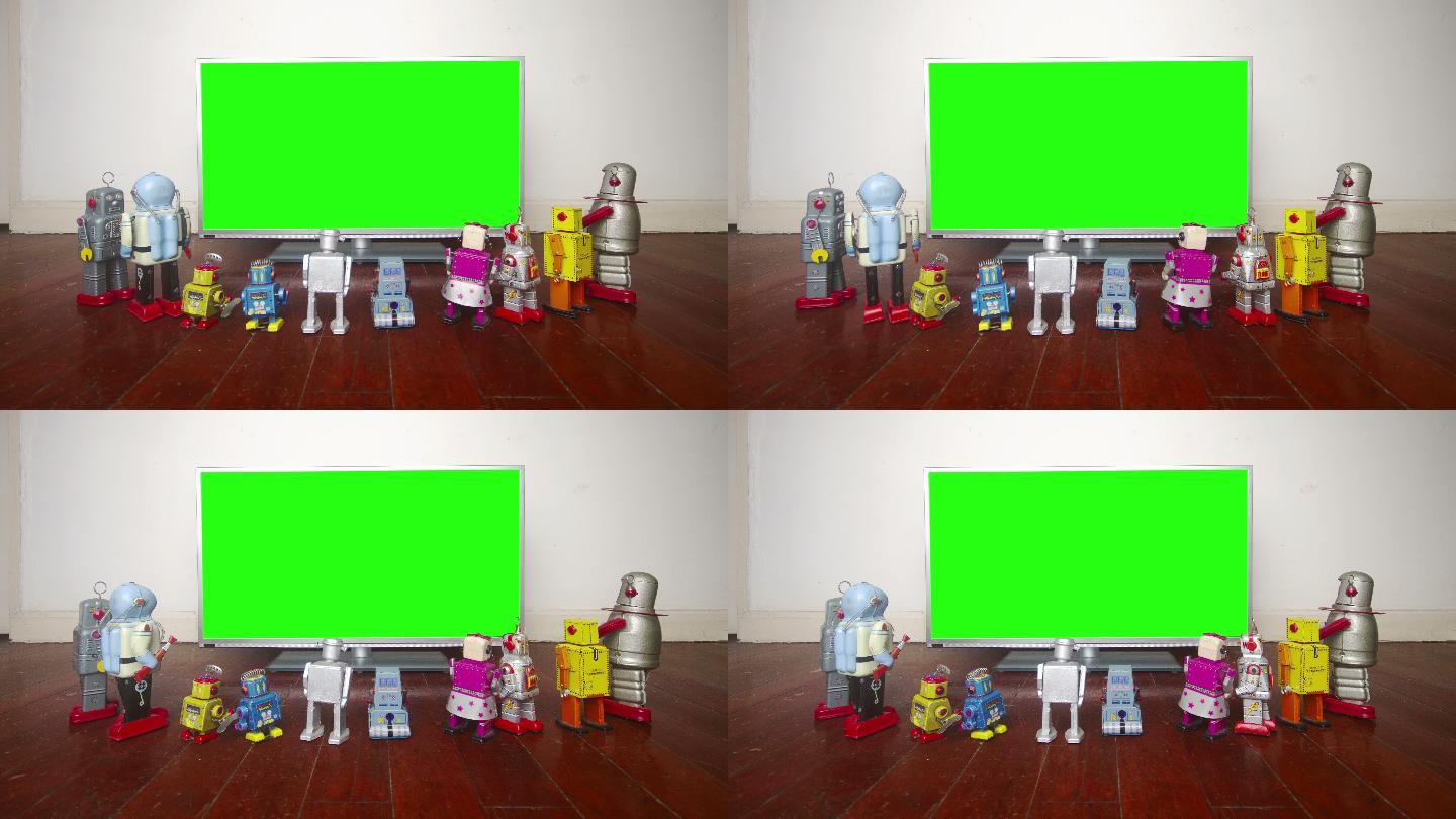 绿色屏幕前的复古机器人玩具