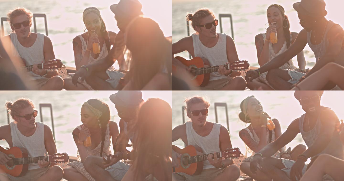 朋友们在码头上弹吉他和聊天