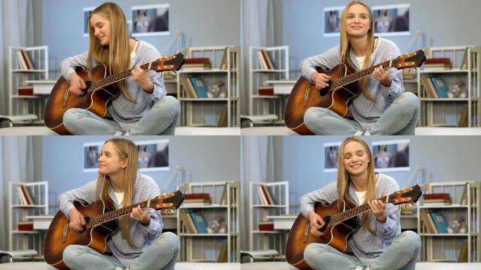 年轻女士在房间里弹吉他，写歌