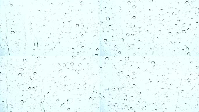 雨滴玻璃上滴雨滴水下雨天空镜空境