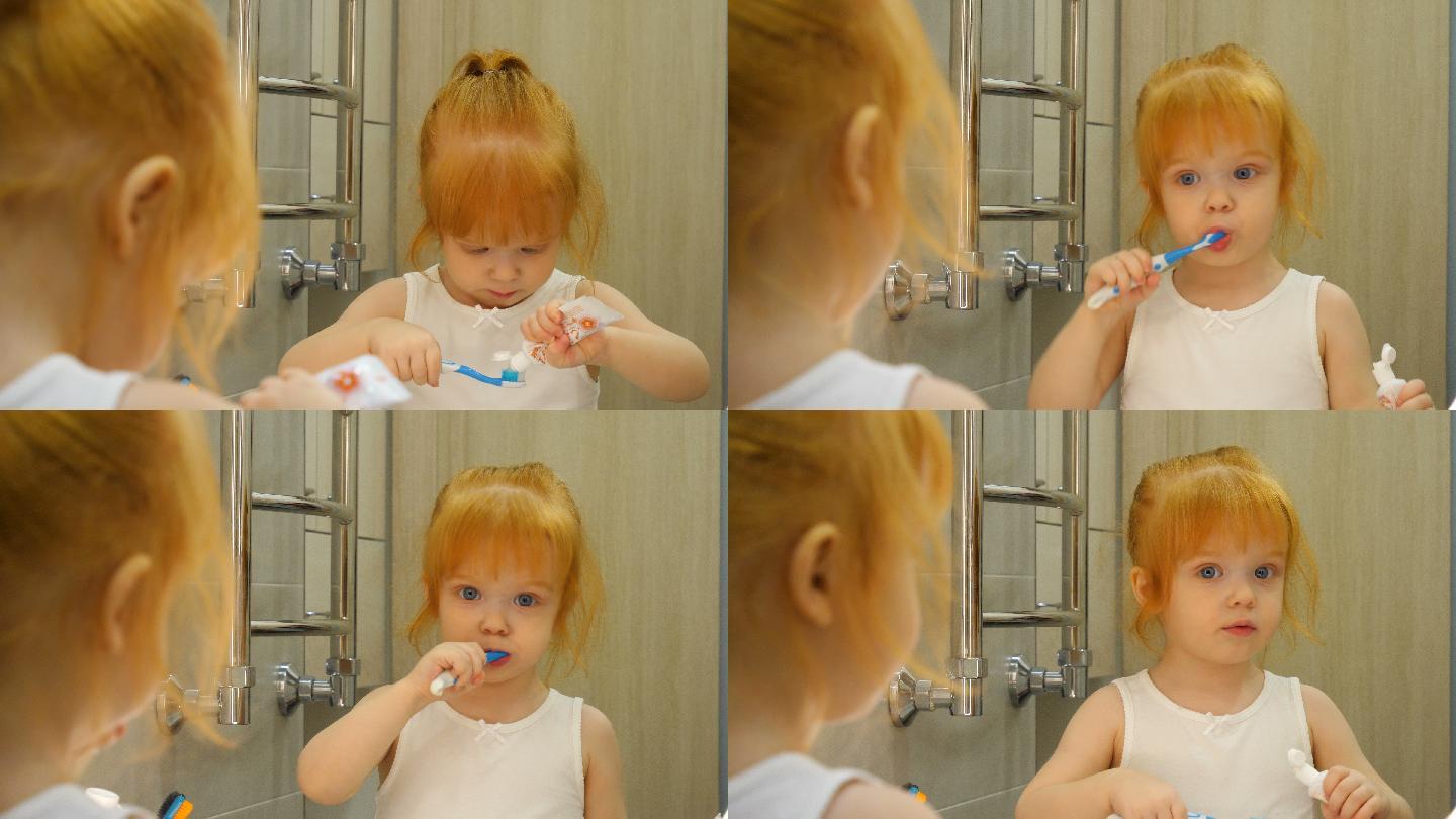 小女孩早上在浴室用牙刷刷牙。