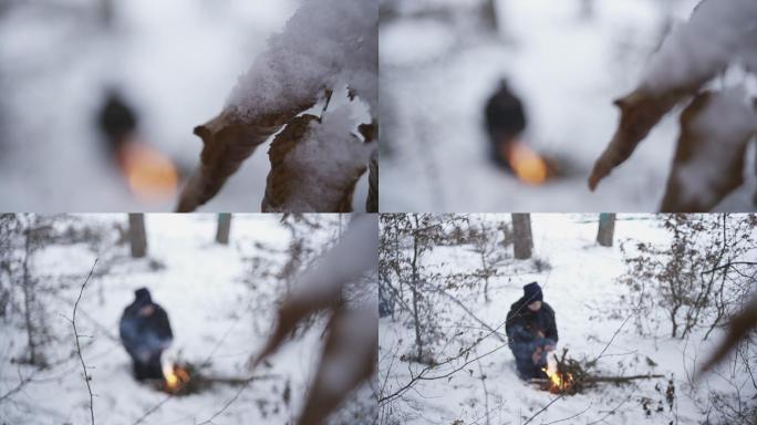 冰雪中小男孩燃起火堆取暖