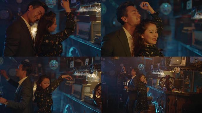情侣在古典酒吧喝酒跳舞