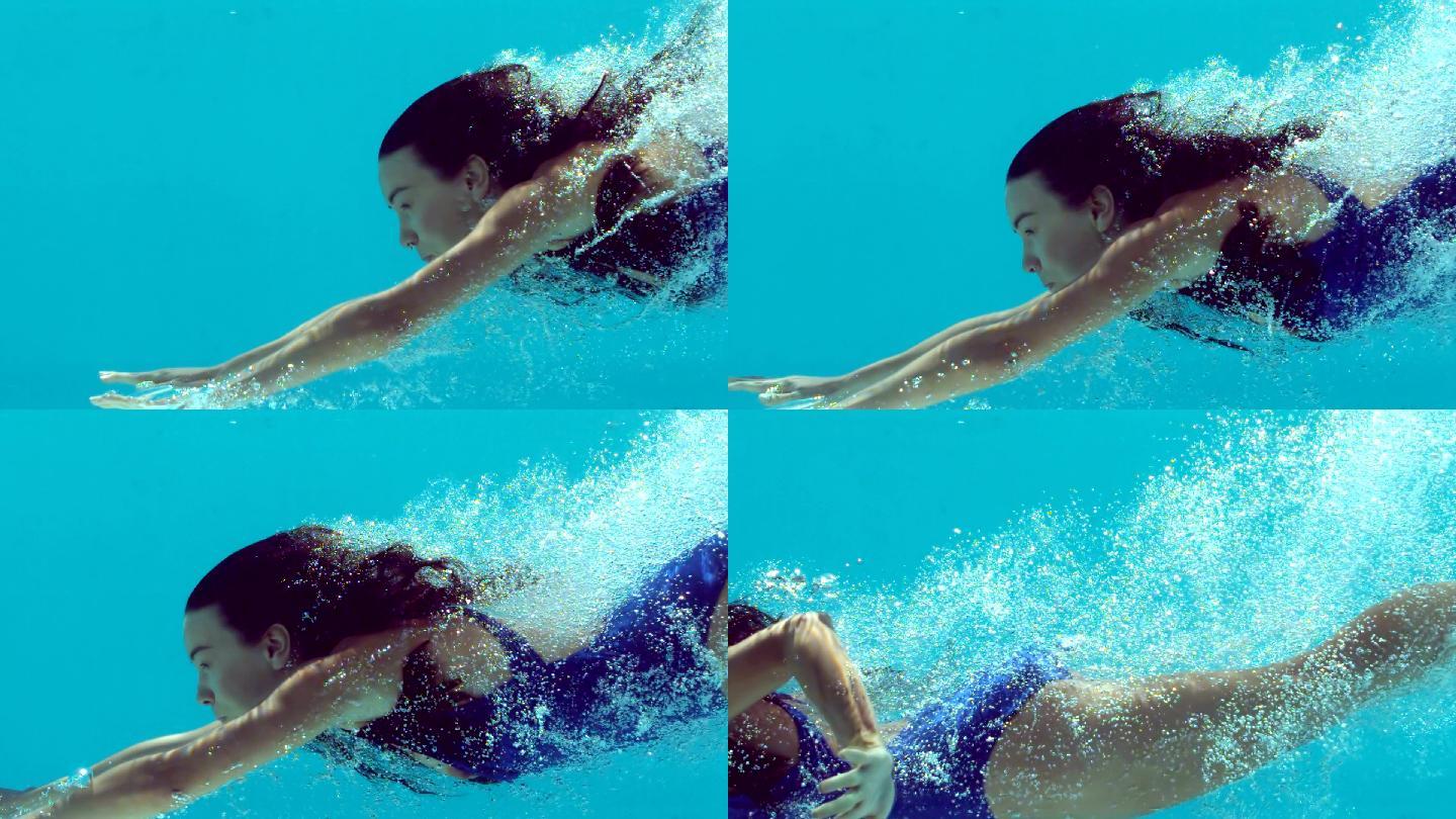 在水下游泳的女人跳入水中美女女性潜泳水底