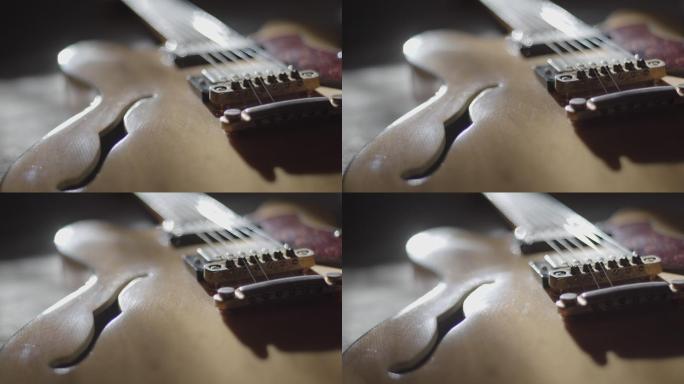 特写镜头：一把旧的半声学空心吉他