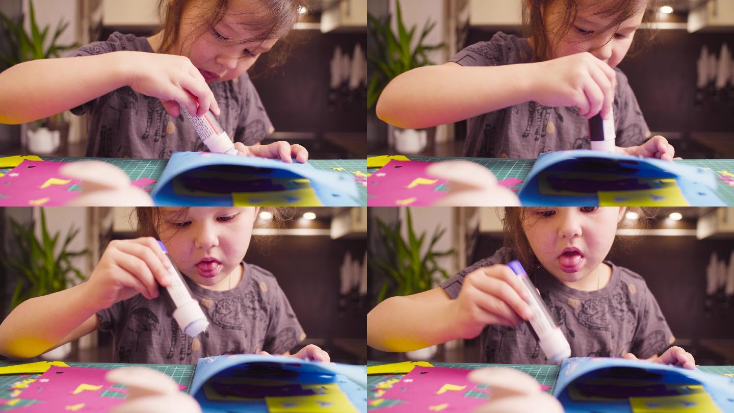 小女孩在粘彩纸DIY手工制作益智